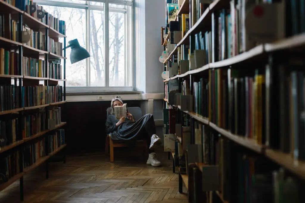 person reading in library