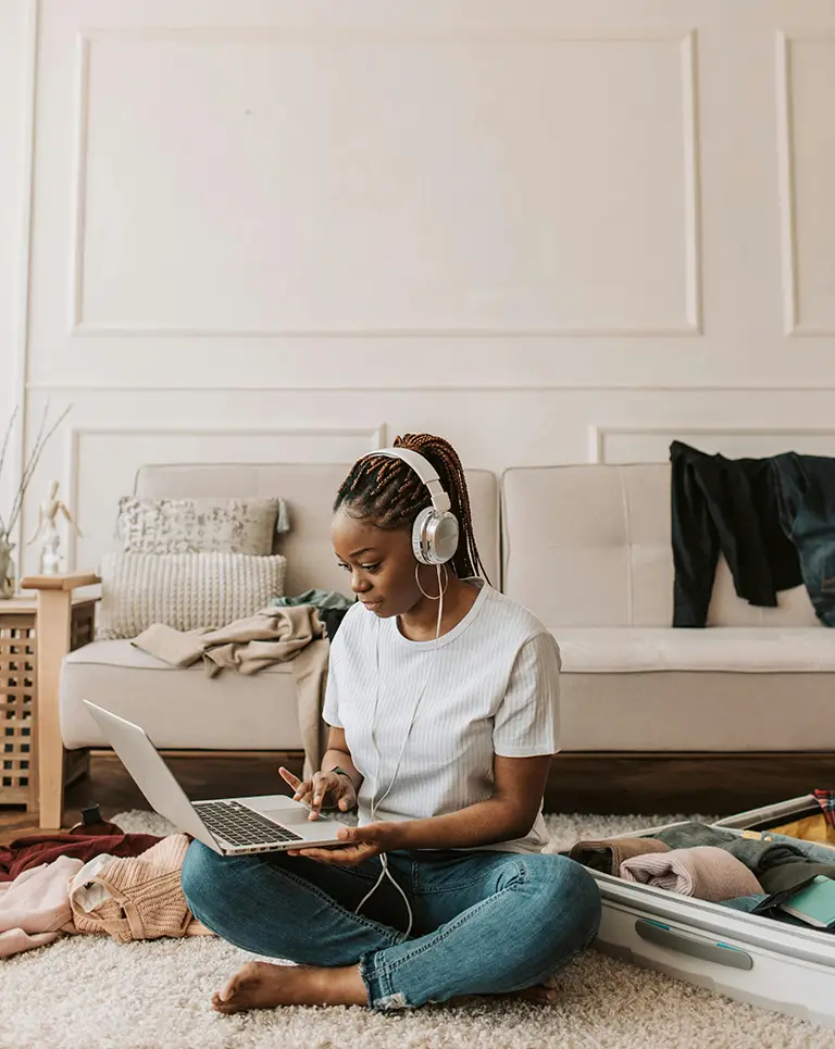 person sitting on floor working