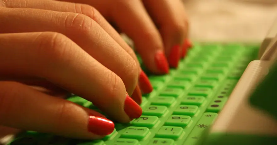 person typing on a keyboard