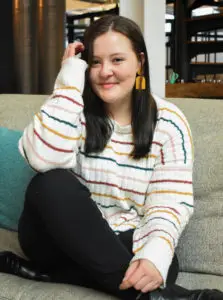 a woman sitting on a couch