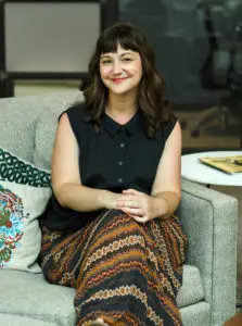 Photo of Melissa sitting in a chair at Versa Coworking