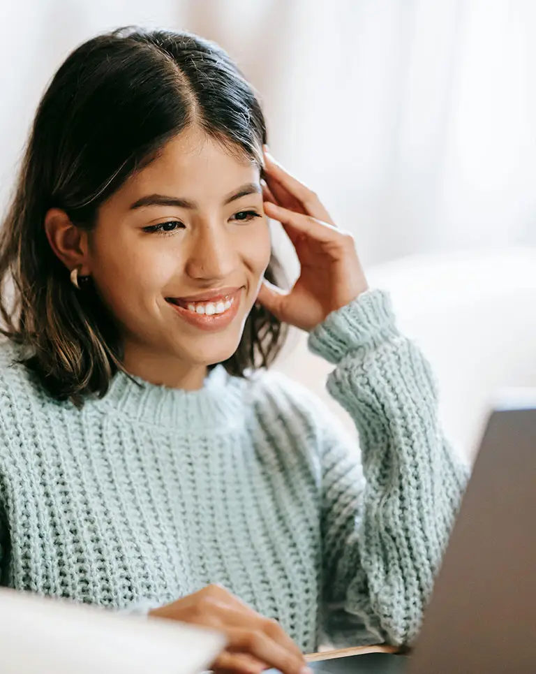 girl looking at computer