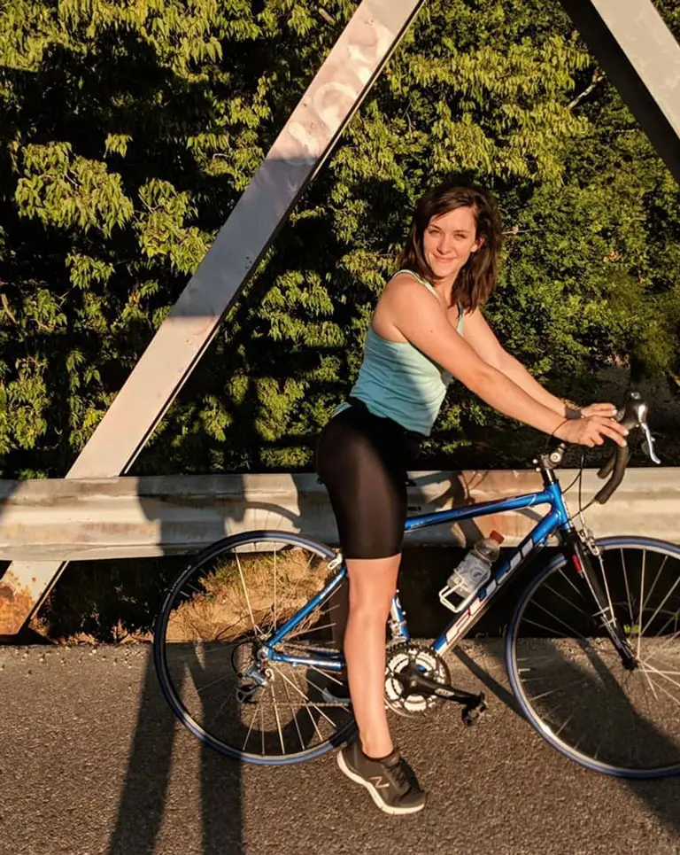 a woman sitting on a bicycle