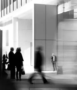 a group of people walking in a building