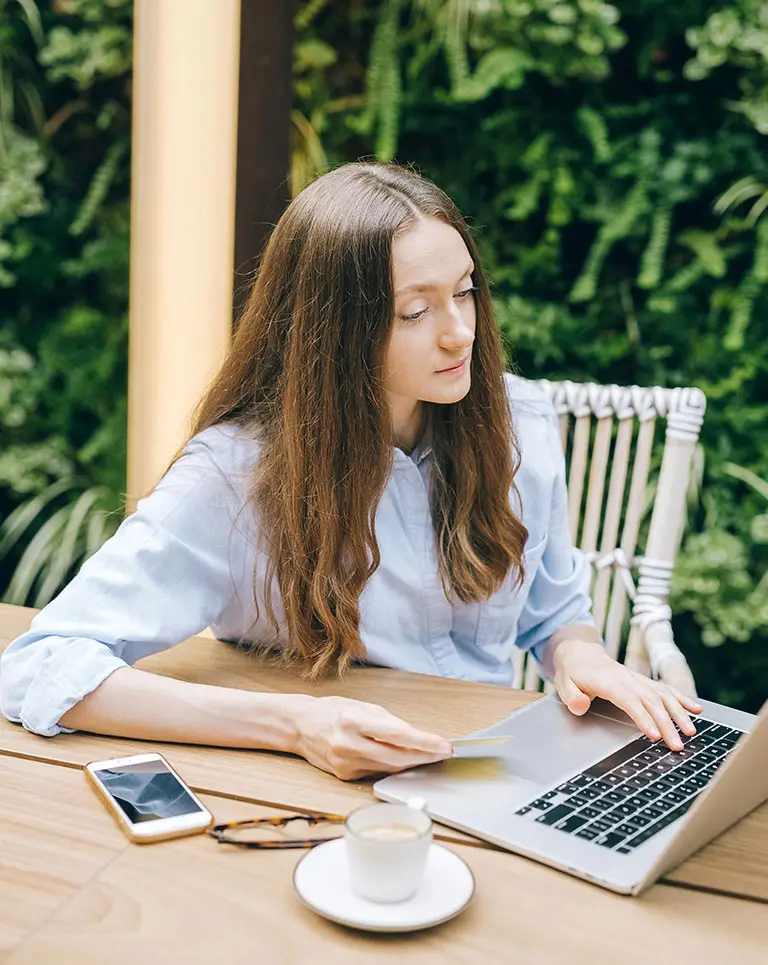 woman on laptop outside